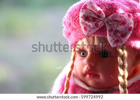 Cute pink doll with gray eyes