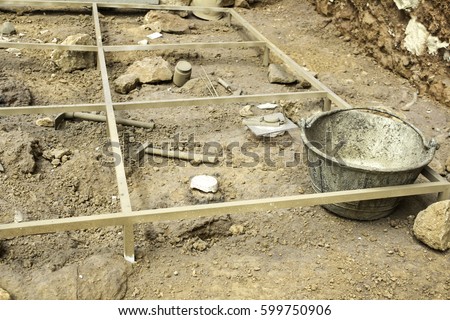 Archaeological excavations on land, professional work and history Royalty-Free Stock Photo #599750906