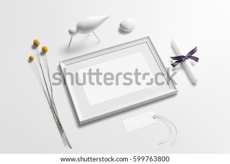 Poster frame mockup, perspective view, with decor elements, candle, flowers, badge and blank copy space on white background.
