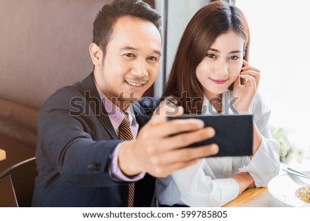asian couple eating and selfie with love together at restaurant