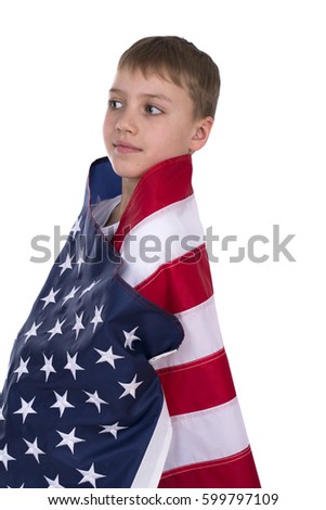 Portrait of Caucasian little boy with American flag in background