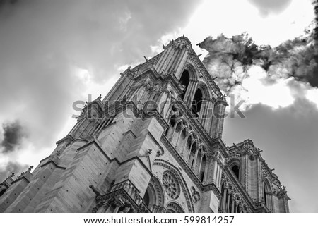 Notre Dame de Paris located along the Seine River in Paris, France                                        Low angle view. Black and white photography