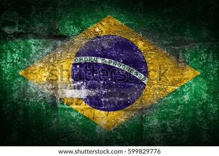 Grunge Brazil flag on stone texture background closeup