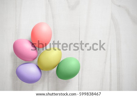 Vintage colorful easter eggs on white wood table background with clipping path of the eggs