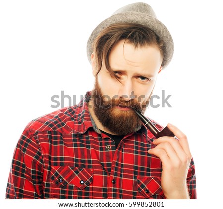 Bearded man in a hat smoking a pipe. Isolated on white background.