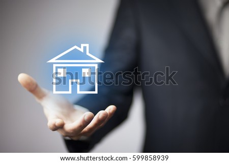 man hand blue house model  in screen