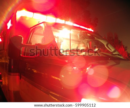                         Ambulance with Lights on        Royalty-Free Stock Photo #599905112