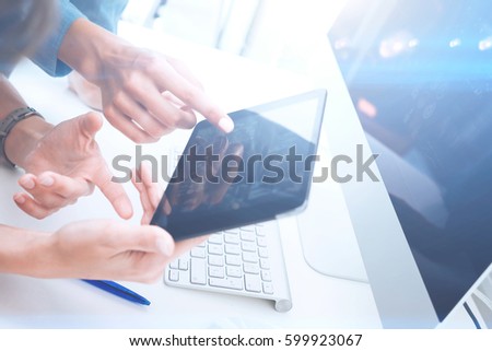 Closeup of female hands holding modern digital tablet and pointing on screen.Concept business people using mobile gadgets.Icon and diagramm on display.Visual effect,color filter,blurred.Horizontal
