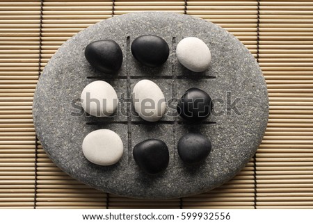 black and white pebbles on zen stone