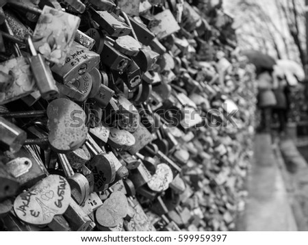 PARIS, FRANCE – MARCH 4TH 2017: A monochrome photograph of the love locks of the Pont Neuf bridge, Paris. 