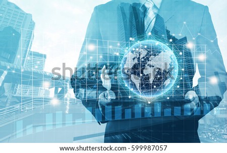 Double exposure of success businessman using digital tablet with city landscape background and network connection concept (Elements of this image furnished by NASA)