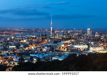 Twilight over Auckland central business district from the top of Mt Eden. Auckland is New Zealand largest city. Royalty-Free Stock Photo #599991017
