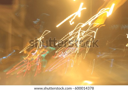 light motion with slow speed shutter,Street lights in speeding car in night time.
