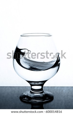 Moving glass water on a white background