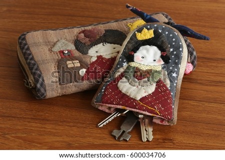 Quilting product. Wallet and Key ring of quilt. Homemade Japanese quilt. Japanese handcraft. Signed property release. Selective focus and toned image.