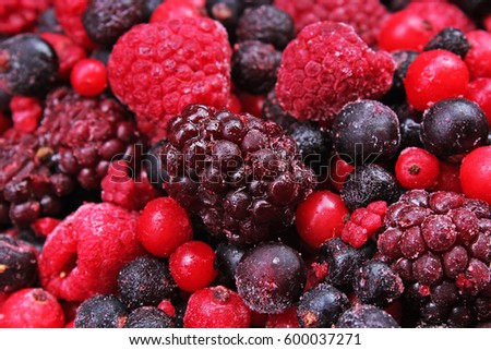 Berries. Frozen mixed berries as background. Blueberries,raspberries black berries and currant mulberry texture pattern.