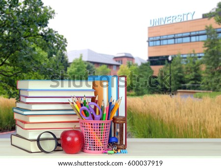 blurry background of university campus in Spring season and book for education and back to school concept