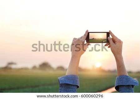 Woman photography rural prairie in sunset, relax time