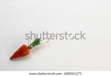Fall autumn harvest spring easter orange carrots lying on white wooden table background with space for titles text