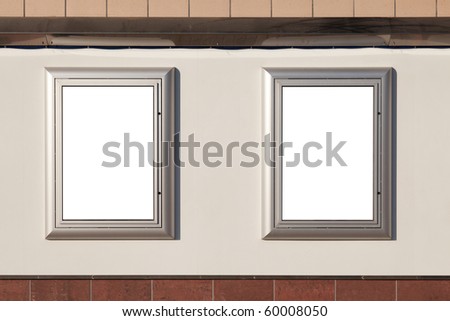 Two blank posters on a wall for your advertisement