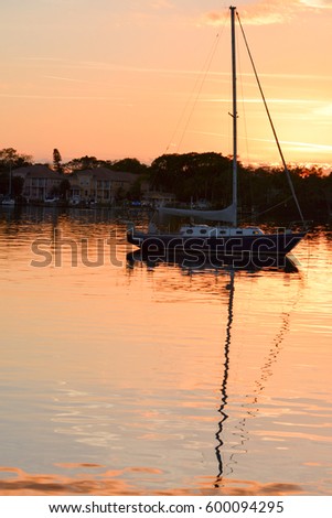 Sunset with a sailboat over St Petersburg Florida, near Tampa Bay