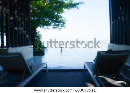 Picture blurred  for background abstract and can be illustration to article of people relax in swiming pool at resort