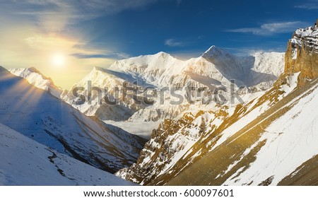 The photo was taken during the trek around the Annapurna mountains in the Himalayas of Nepal. The picture was taken in the morning at sunrise, photographed peak of Mount Annapurna 2.