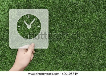 Clock symbol message box with green grass background