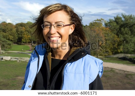 Attractive brunette in the park on the fall