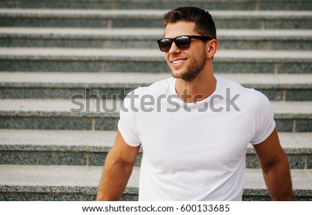 Handsome man smiling with perfect teeth. Dental care  Royalty-Free Stock Photo #600133685