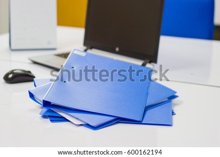 file folder with documents and Notebook background  on white table in meeting room