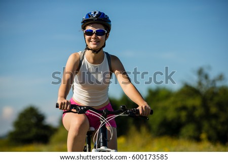 Young woman cycling outdoor 