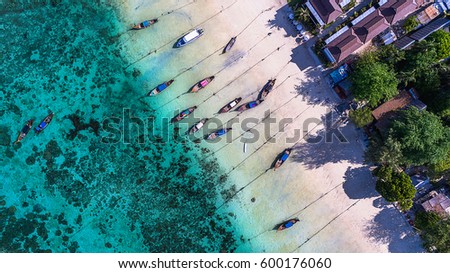 Aerial view over group of long tail boats and buildings,Top view from drone, Koh Lipe island, Satun province,Thailand