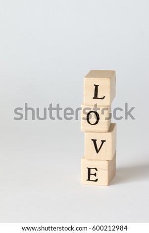 wooden cubes written as LOVE