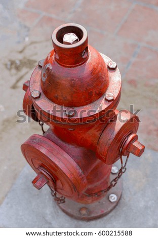 Red fire hydrant water pipe near the road. Fire hydrant for emergency fire access