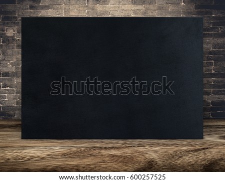 Blank long black fabric canvas frame at grunge brick wall and wood floor,Mock up template for adding your content or design,Business presentation.