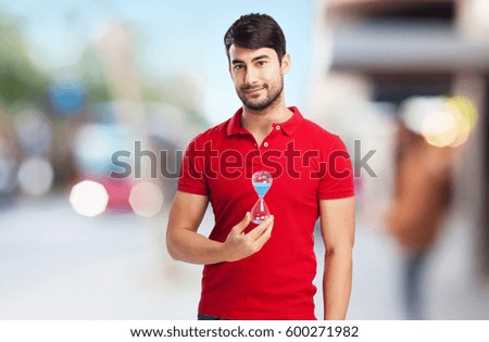 man holding sand-timer