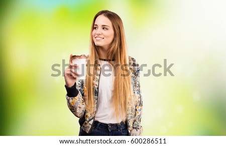pretty young woman having a coffee