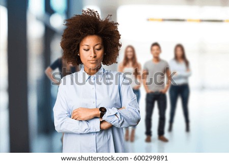 young black woman crossing arms