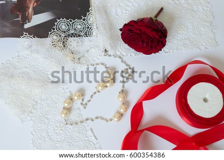 
Rose, costume jewelery, accessories on white background