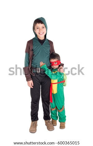 little kids dressed for halloween posing
