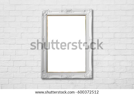 white frame on white brick wall