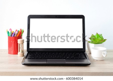 Lab-top, notebook computer with blank screen on office table background, mock up display, business and technology concept