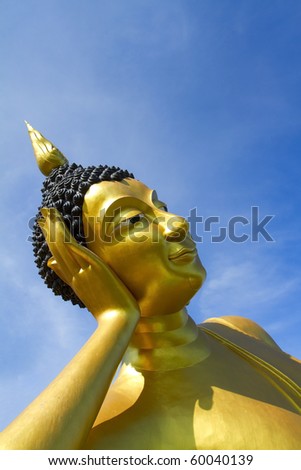 Big Buddha Image of the sky against a backdrop of Wat Thai in Thailand