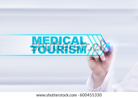 Medical doctor drawing medical tourism on the virtual screen.