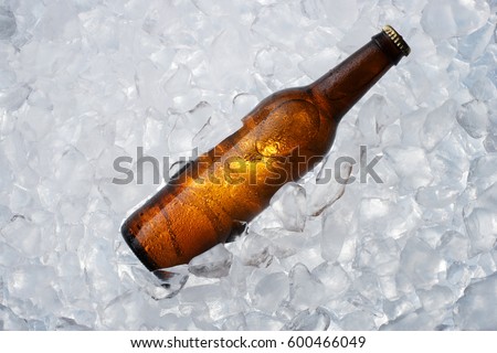 A brown bottle on ice Royalty-Free Stock Photo #600466049