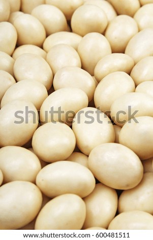 White chocolate balls. White chocolate as background texture pattern. 