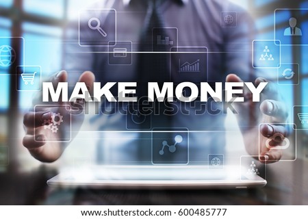 Businessman using tablet pc and selecting make money.
