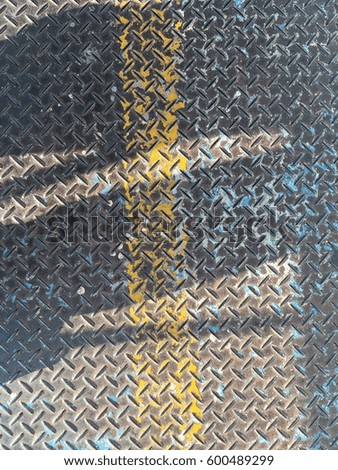 Floor Steel plate paint with yellow line texture background

