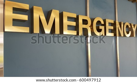Close up photo of red large letters spelling emergency Royalty-Free Stock Photo #600497912